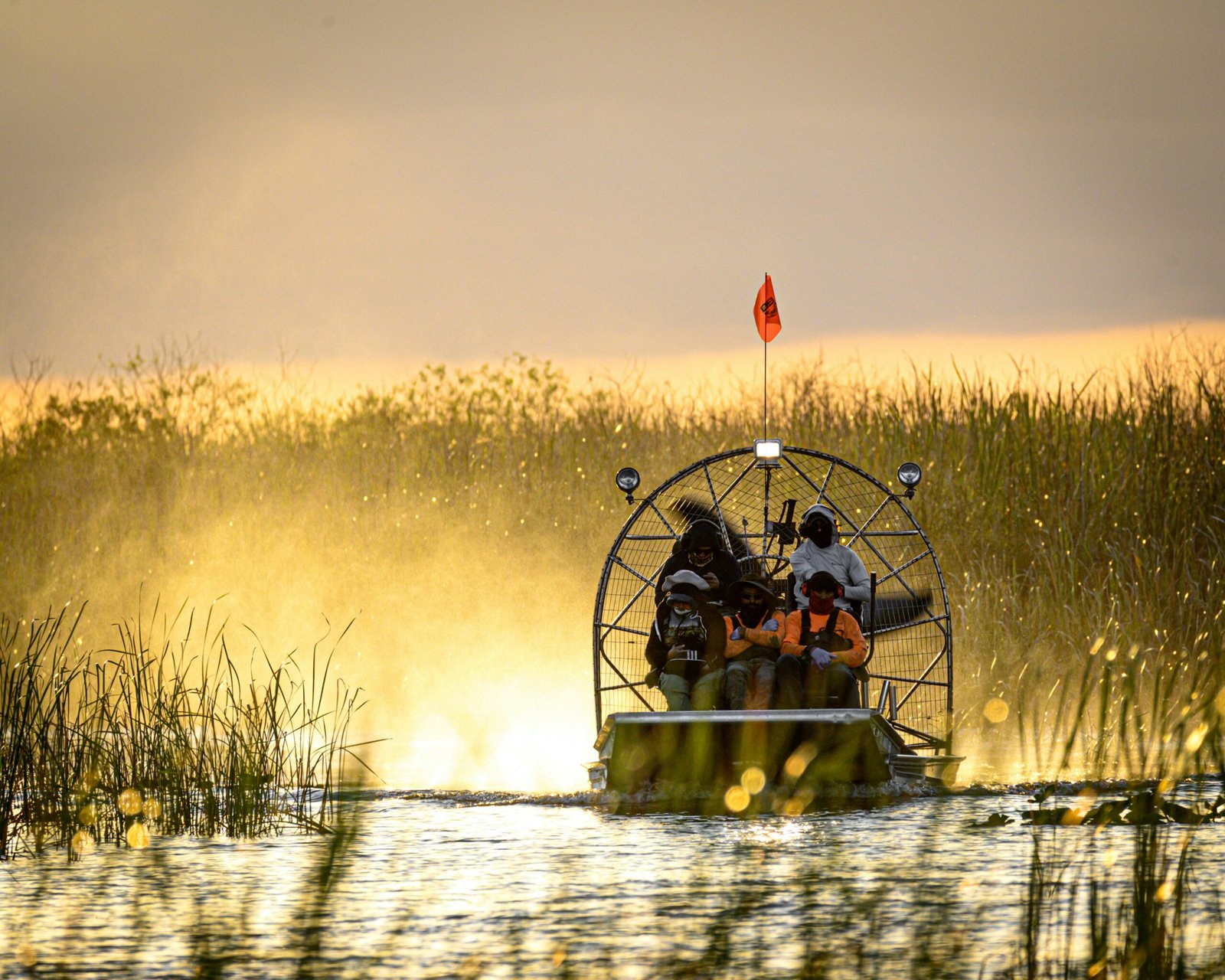 Family smiling on an airboat during an Orlando airboat ride with no age restriction